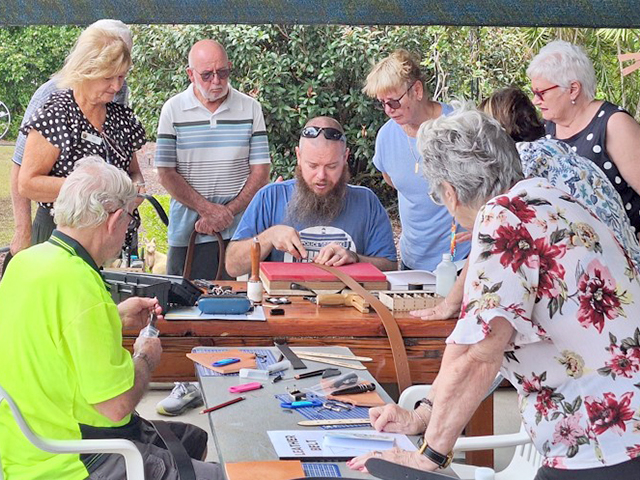 Logan Village members learning how to skive the edges.
