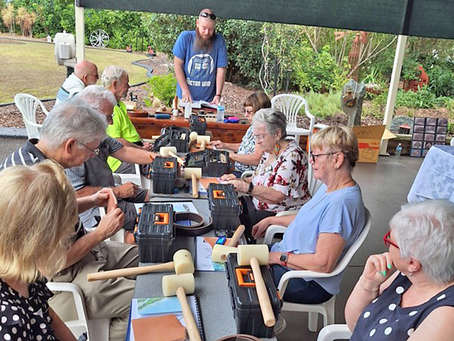 Members learning about the many types of leather and basic tools.